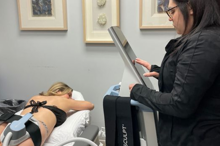 Blonde female patient at Vive Aesthetics & Wellness receiving Emsculpt near Cherry Hill, NJ, for her buttocks.