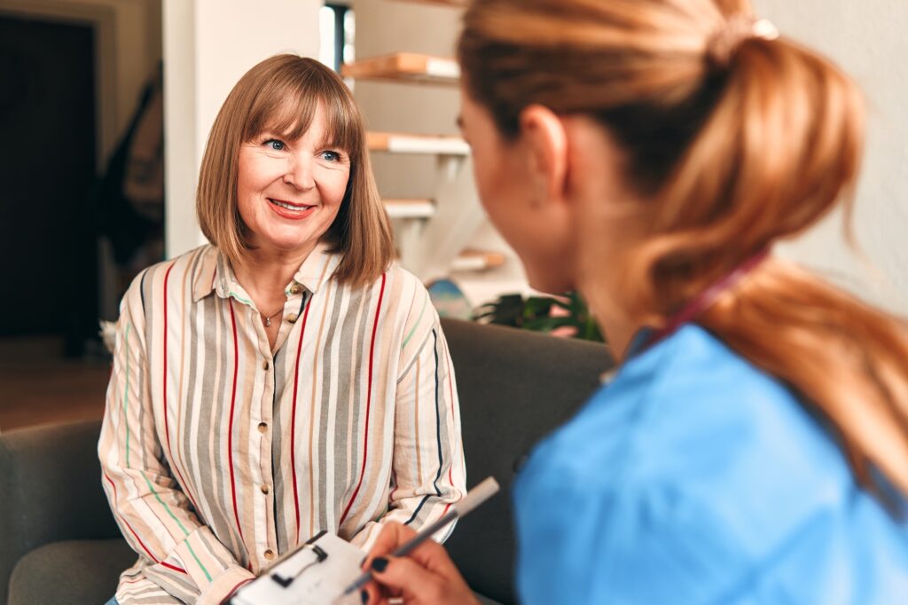 A patient smiles as she meets with a weight loss doctor near Moorestown, NJ